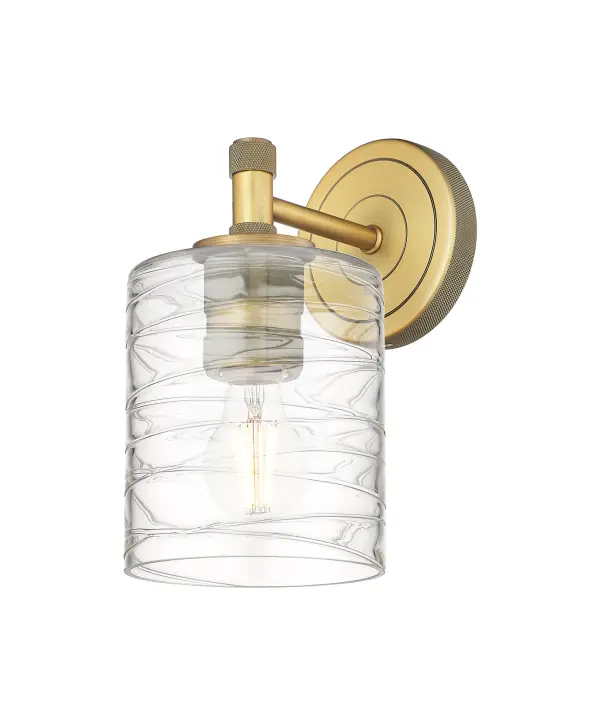 Details abound in the Crown Point Collection with an industrial take on modern sophistication. This stunning line of fixtures features cylindrical glass set in an updated restoration style frame with intricate knurling detail on the sockets, canopy, and finials.