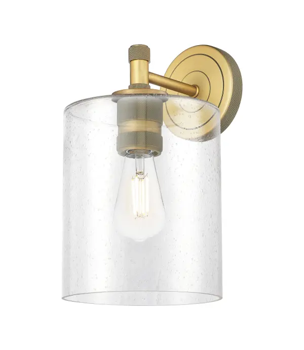 Details abound in the Crown Point Collection with an industrial take on modern sophistication. This stunning line of fixtures features cylindrical glass set in an updated restoration style frame with intricate knurling detail on the sockets, canopy, and finials.