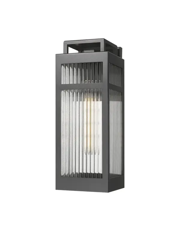 The Ridgeway Collection delivers a modern take on the classic lantern, defined by its striking vertical lines and distinctive ribbed glass. Available in clear for crisp, bright illumination or sanded for a soft, diffused glow, Ridgeway adds both texture and sophistication to your exterior. A sturdy rectangular frame—offered in matte black or warm brass—encases the glass, with a sleek handle detail that adds subtle architectural flair. Coastal Rated for lasting performance in seaside environments, Ridgeway pairs beauty with resilience, making it perfect for pathways, patios, or entryways where design and durability matter most.