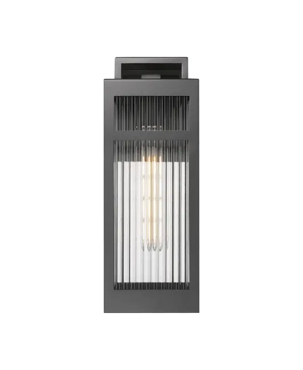 The Ridgeway Collection delivers a modern take on the classic lantern, defined by its striking vertical lines and distinctive ribbed glass. Available in clear for crisp, bright illumination or sanded for a soft, diffused glow, Ridgeway adds both texture and sophistication to your exterior. A sturdy rectangular frame—offered in matte black or warm brass—encases the glass, with a sleek handle detail that adds subtle architectural flair. Coastal Rated for lasting performance in seaside environments, Ridgeway pairs beauty with resilience, making it perfect for pathways, patios, or entryways where design and durability matter most. - alternate view